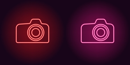 Neon icon of Red and Pink Photo Camera. illustration of Red and Pink Neon Camera consisting of neon outlines, with backlight on the dark backgroundのイラスト素材