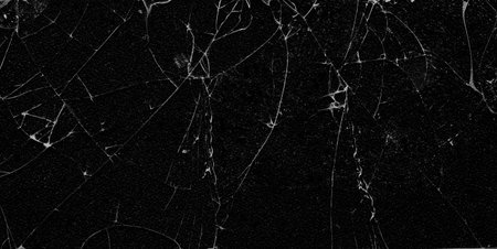Texture of broken glass on a black background. stock image Damage with shrapnel.