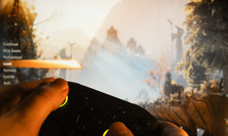 Gamer plays Dragon Age: Inquisition with a gamepad. Stock editorial photo of the games initial menu. Ukraine, Kiev. 04.14. 2024のeditorial素材