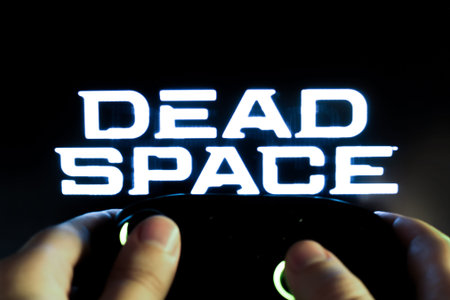Gamer plays Dead Space with a gamepad. Stock editorial photo. Ukraine. Kiev. 04.14.2024