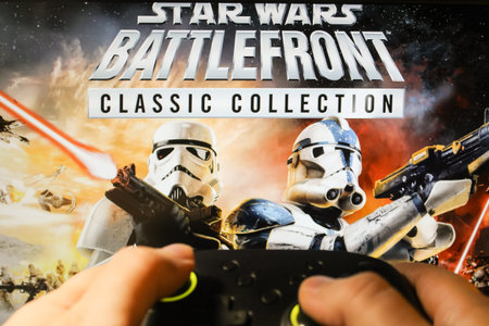 A gamer plays Star Wars: Battlefront with a gamepad. Stock editorial photo. Ukraine. Kiev....