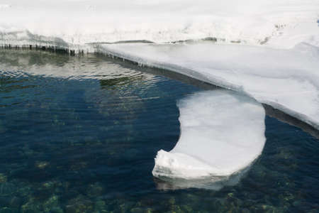 Background of ice cold water with stonesの写真素材