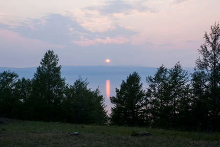 Dramatic landscape of the coast in the twilight - the rays of the sunの写真素材