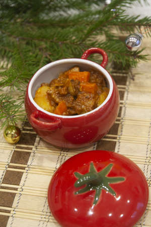 Hot winter meat stew with potatoes and spices, carrots and greens. Goulashの写真素材
