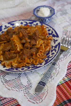 Hot pasta with meat in spices and tomato sauce. Asian cuisineの写真素材