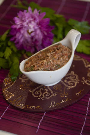 Sauce of tomatoes and walnuts - cilantro, mint, garlic, onions - a lean modern dishの写真素材