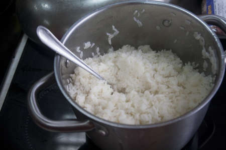 master class cooking rice cook in the kitchen in a panの写真素材