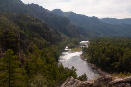 Mountain landscape with river and sky - natural monument Shamans trail in the Republic of Khakassiaの写真素材