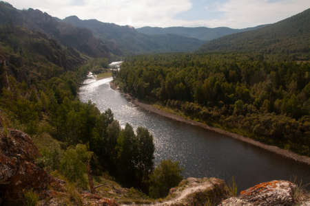 Mountain landscape with river and sky - natural monument Shamans trail in the Republic of Khakassiaの写真素材
