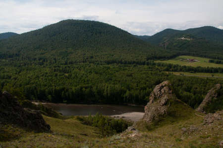 Mountain landscape with river and sky - natural monument Shamans trail in the Republic of Khakassiaの写真素材