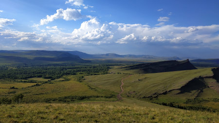 High autumn hills and mountains, foggy horizon with clouds - horizontal landscape photographyの写真素材