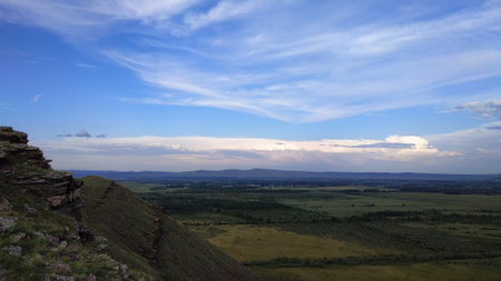High autumn hills and mountains, foggy horizon with clouds - horizontal landscape photographyの写真素材