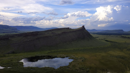 High autumn hills and mountains, foggy horizon with clouds - horizontal landscape photographyの写真素材