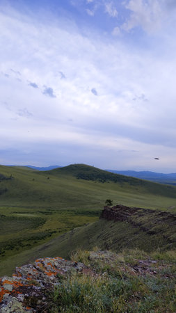 High autumn hills and mountains, foggy horizon with clouds - horizontal landscape photographyの写真素材