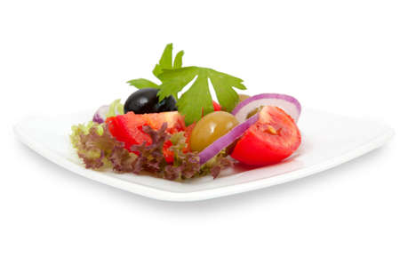 fresh vegetable salad in white dish on white backgroundの写真素材
