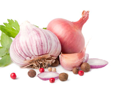 garlic and onion on white background with pepper and parsleyの写真素材