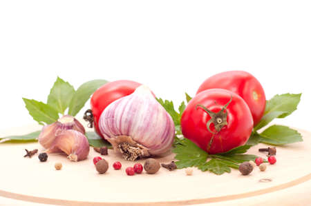 red tomato and garlic on white backgroundの写真素材