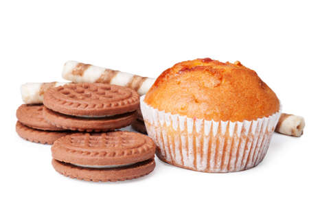 Chocolate cookies and muffin on a white backgroundの写真素材