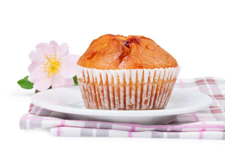 Strawberry muffin and plate on a white backgroundの写真素材