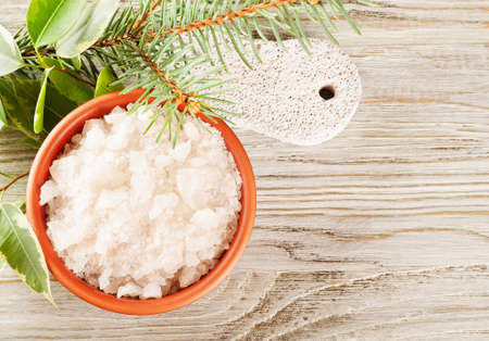 Aromatic bath salt in a clay cup and pumice stoneの写真素材
