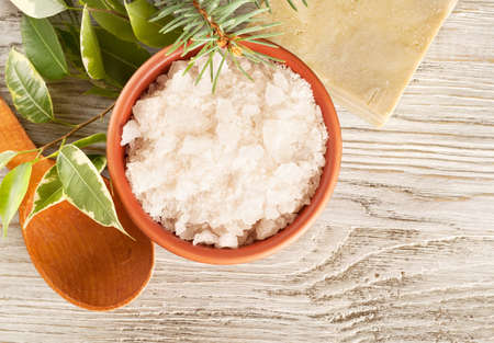 Aromatic bath salt in a clay cup and soapの写真素材