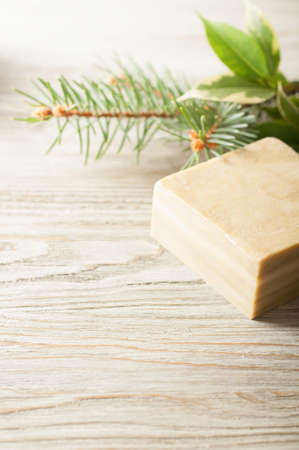 Bar of natural herbal handmade soap on a wooden backgroundの写真素材