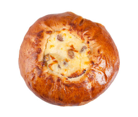 Fresh homemade bun with cottage cheese and raisins isolated on a white background. Top view.の写真素材