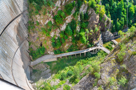 Top view from Vidraru dam on Arges river in Transylvania, Romania.  Fagaras ridge in the Carpathian mountains. Hydro electric power stationのeditorial素材