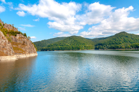 Vidraru artificial lake and dam on Arges river in Transylvania, Romania. Beautiful landscape in Carpathian mountains, Fagaras ridge.のeditorial素材
