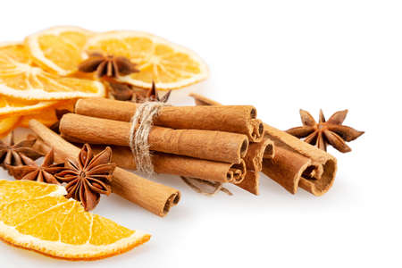 Dried orange slices, cinnamon and star anise. Spices for mulled wine on a white background.の写真素材