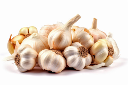 Heap of white garlic heads and cloves isolated on white background. Garlic clove closeup on white background. AI-Generated imageの素材