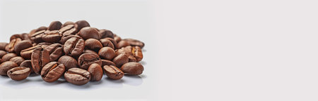 Heap of fresh roasted coffee beans isolated on white background with copy space. Roasted brown coffee beans or seed on white background. AI-Generated imageの素材
