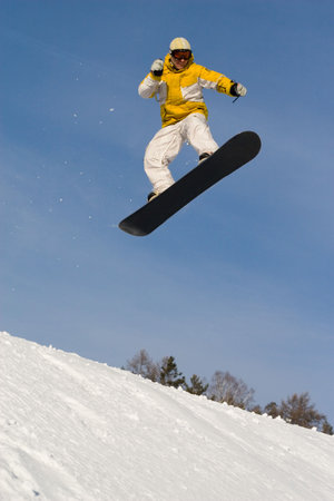 Ekstremaly. Persons rides and jumps on snowboard.