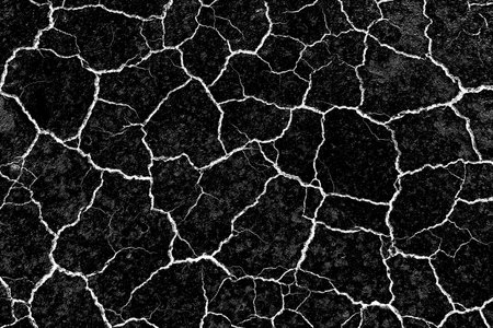Old wall with cracked plaster. Weathered rough surface. Vintage texture is perfect for background and design.の写真素材