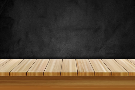 Empty wooden table over black textured chalkboard for product displayの写真素材