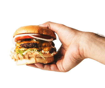 Hand holding hamburger on white . fresh tasty hamburger. Large fresh burger with meat and cheese...