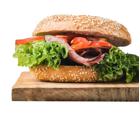 Classic cheeseburger on wood and pickles. Cheese, tomatoes, onions. Lettuce, mustard and ketchup isolated on white background . fresh tasty burger isolated on white background .の写真素材