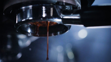 Close-up of Americano pouring from the coffee machine into a cup. Professional coffee brewing black coffee . Professional espresso machine while preparing espressos coffee cupの写真素材