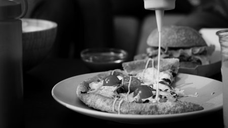 Delicious Margherita pizza and ingredients on wooden table