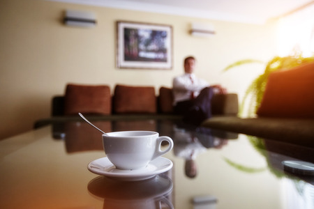 businessman relaxes in his office after a Cup of coffeeの写真素材