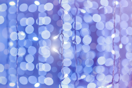 Soft colorful bokeh background. Luminous garlands of electric lights. Copy space to add text....