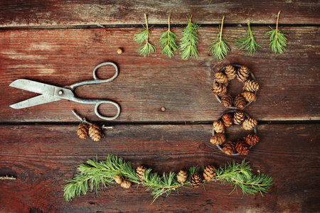 Christmas background on old wooden boards with decorative element in the shape of a figure eight,...