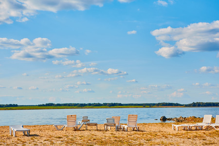 Sun loungers on the deserted river beach. Place of rest in Russiaの写真素材