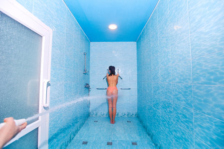 Woman having high pressure massage with Sharko shower