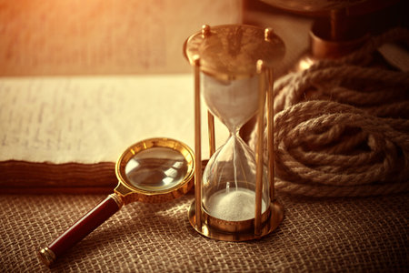 Old vintage items of the treasure hunter, traveler and discoverer - a magnifying glass, old...
