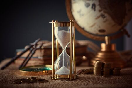 Old globe, coins, magnifying glass, keys to chests, rope, pirate map and marine logbook. Travel and marine prints background. The concept of a treasure hunter. Vintage styleの写真素材