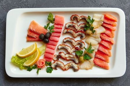 Assorted fish on a white plate. The view from the top.の写真素材