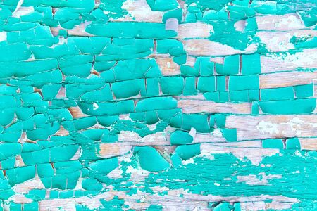 blue and turquoise old Board with cracks from old paint, vintage grunge style with cracked surface background for your text, decoration or advertising template, retro art.の写真素材