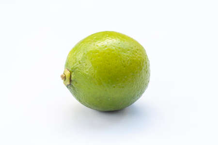 Limes with slices isolated on white backgroundの写真素材