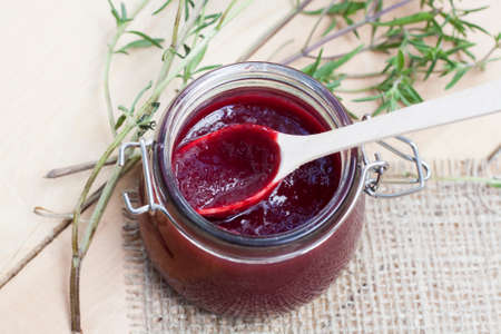 Home made organic cherry jam confiture on a wooden tableの写真素材